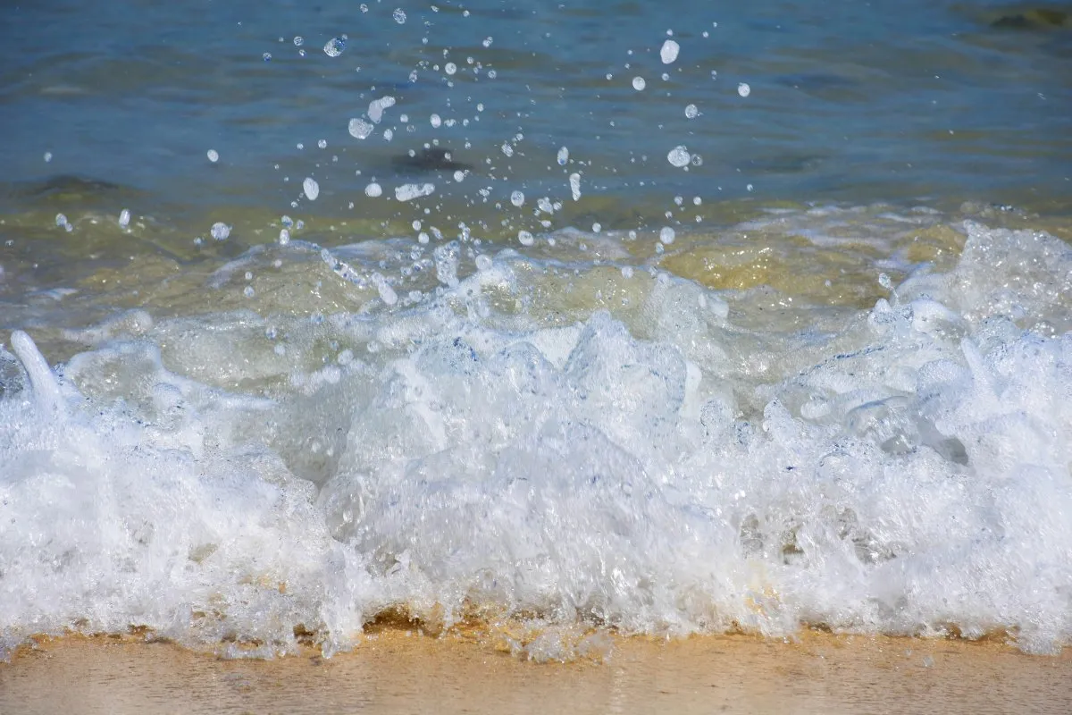 Closeup of sea waves splashing on a beach in Mauritius