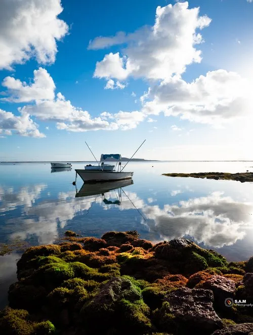 Reflection of sky in crystal clear sea