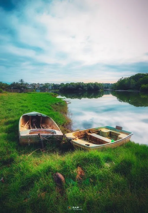 Two dinghies on shore of Tamarin River