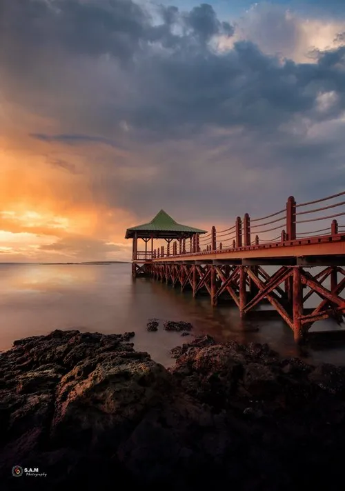 Sunrise at Mahebourg jetty under clouds