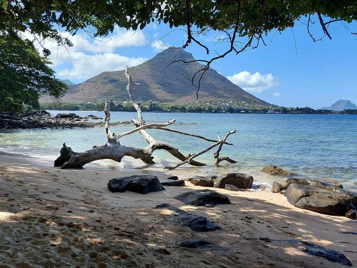 Beach and lagoon view with Tourelle Mountain in the background on the west coast of Mauritius